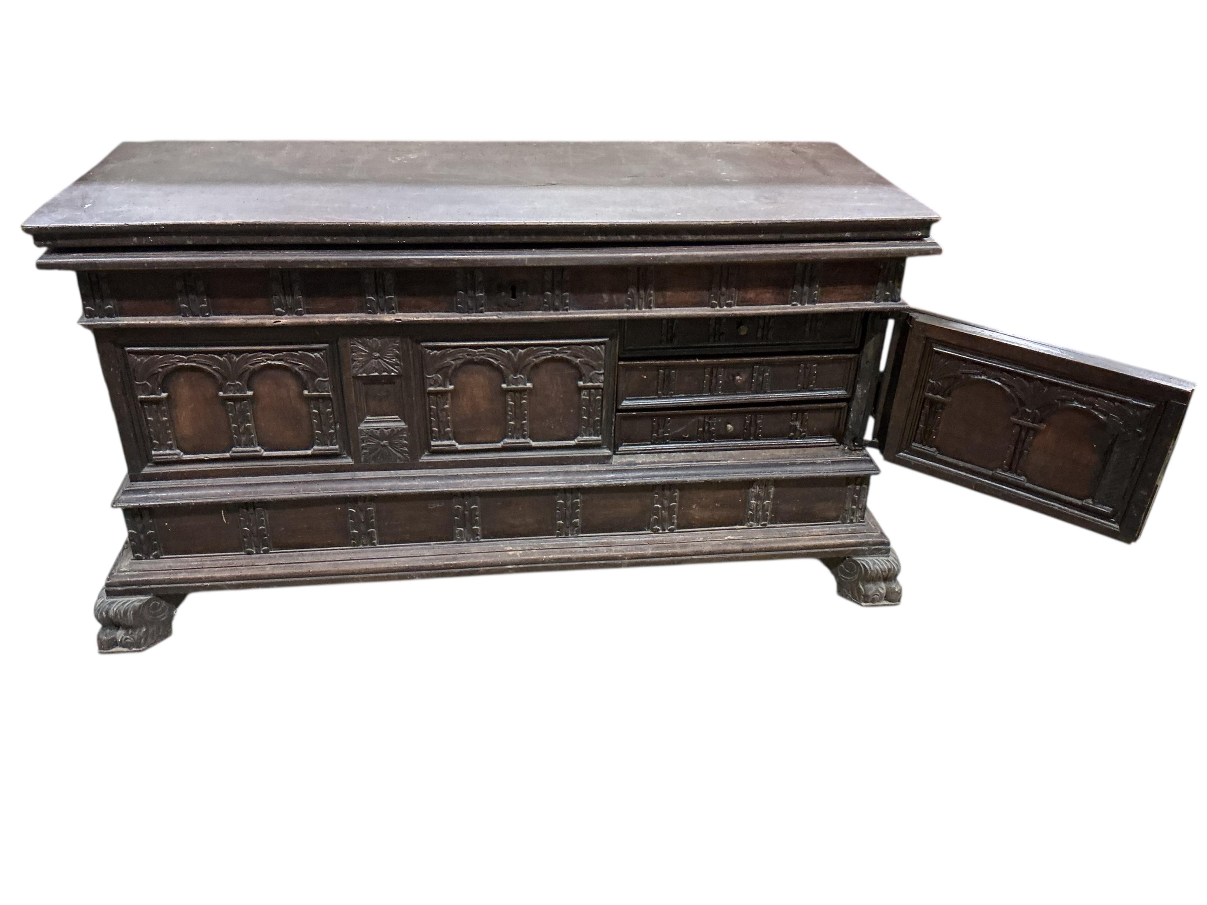 An Italian carved walnut cassone, width 138cm, depth 54cm, height 76cm